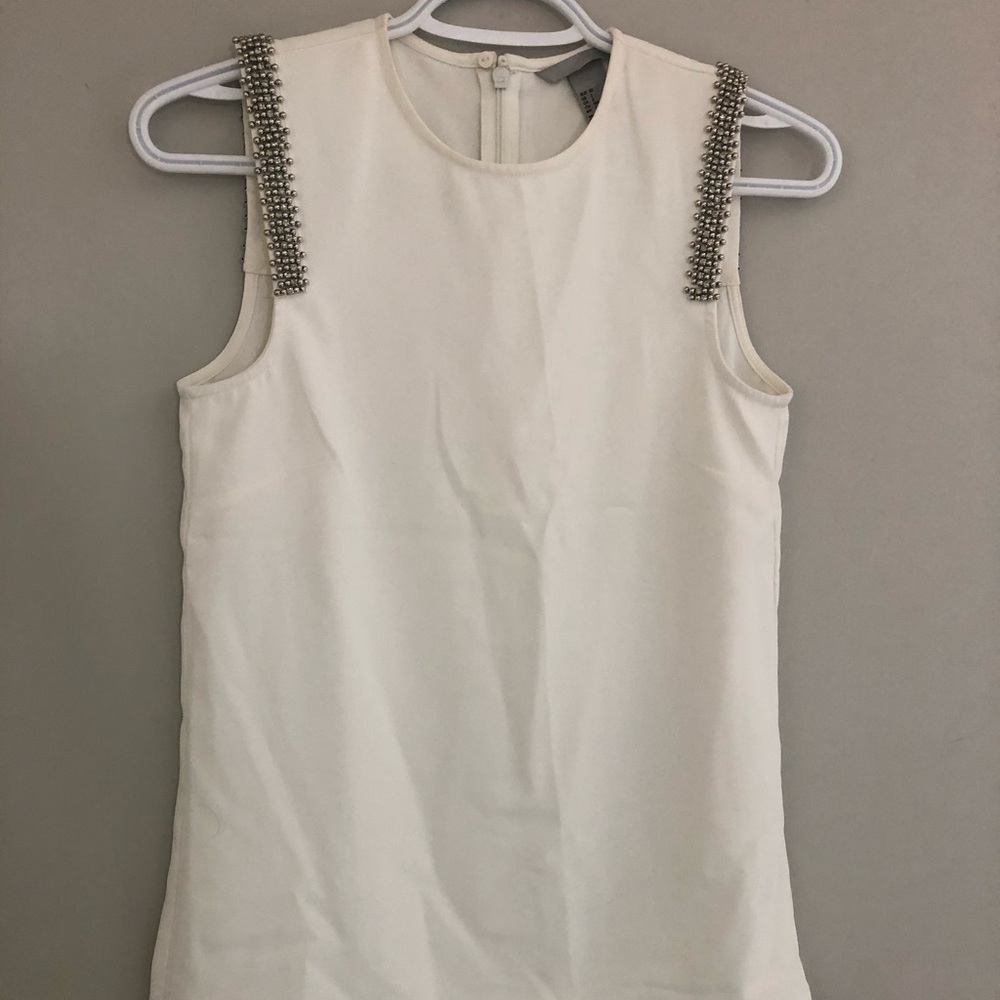 Sleeveless top with embellishments